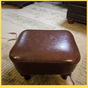 May include: A rustic wooden sign with the text "Welcome to our home" in white lettering. The sign features a distressed finish and a simple, inviting design, perfect for a front porch or entryway.