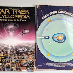 May include: Two vintage Star Trek books. The Star Trek Encyclopedia, a reference guide to the future, features a spaceship graphic. Star Trek Concordance has a blue and green graphic of a spaceship.