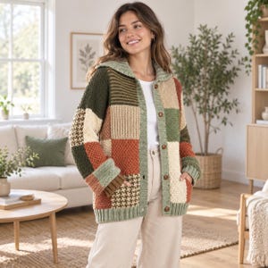 May include: A long-sleeve button-down cardigan featuring a multi-colored patchwork design in shades of olive green, rust orange, cream, and brown. The knit garment includes a ribbed collar, cuffs, and hem, along with two front pockets and brown buttons.