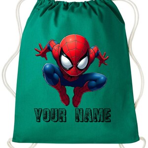 May include: A teal drawstring backpack featuring a graphic of Spider-Man in a dynamic pose. The superhero is depicted in his classic red and blue suit. The text "YOUR NAME" is printed in a green, textured font below the character.