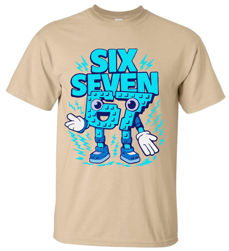 May include: A tan t-shirt featuring a cartoon graphic of the words "SIX SEVEN" in blue, with the numbers designed as a character with arms, legs, and a smiling face. The design includes lightning bolt accents.