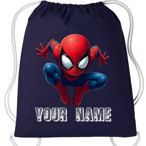May include: Navy blue drawstring bag featuring a vibrant illustration of Spider-Man in a crouching pose. The superhero is depicted in his classic red and blue suit. The text "YOUR NAME" is printed in white block letters at the bottom.
