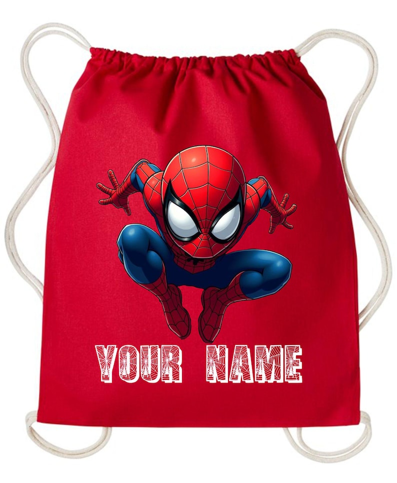 May include: Red drawstring backpack featuring a graphic of Spider-Man in a crouching pose. The superhero is depicted in his classic red and blue suit. The text "YOUR NAME" is printed in white across the bottom of the bag.