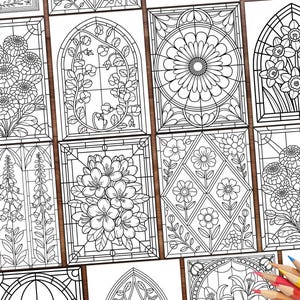 May include: A collection of black and white floral stained glass coloring pages. Each page features a different floral design, including daisies, daffodils, and other flowers. A hand holds a pencil, and colored pencils are in the corner.