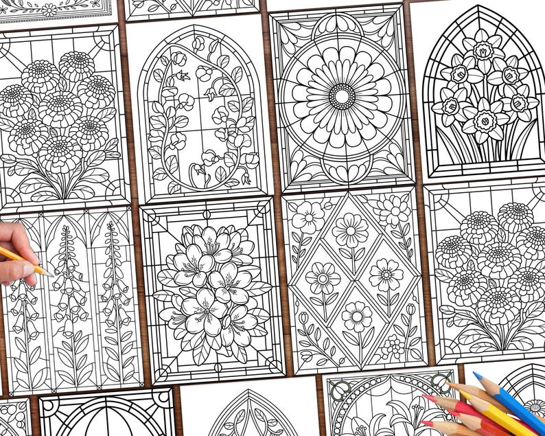 May include: A collection of black and white floral stained glass coloring pages. Each page features a different floral design, including daisies, daffodils, and other flowers. A hand holds a pencil, and colored pencils are in the corner.