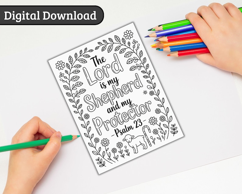 May include: A black and white coloring page with the text "The Lord is my Shepherd and my Protector - Psalm 23" surrounded by floral and leaf designs. A hand holds a green pencil, and another holds colored pencils.