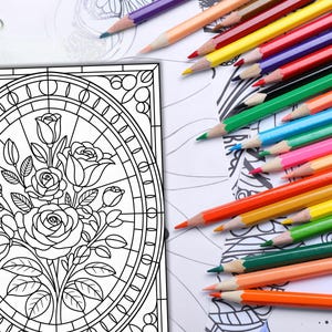 May include: A coloring book page featuring a floral design with roses and leaves, alongside a collection of colorful pencils. The pencils are arranged in a vibrant array of colors, including red, yellow, green, and blue, ready for use.