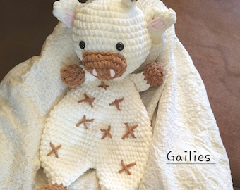 Manta de apego para bebé con forma de jirafa tejida a crochet, suave y acogedora.