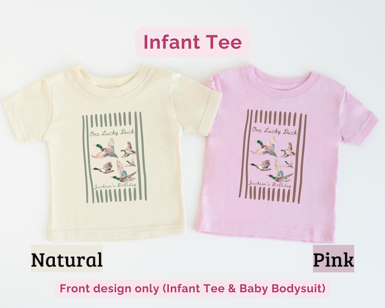 May include: Two infant tees, one natural and one pink, are displayed. Each tee features a graphic of flying ducks with the text "One Lucky Duck" and "Jackson's Birthday" within a vertical striped frame. The text "Infant Tee" is above.