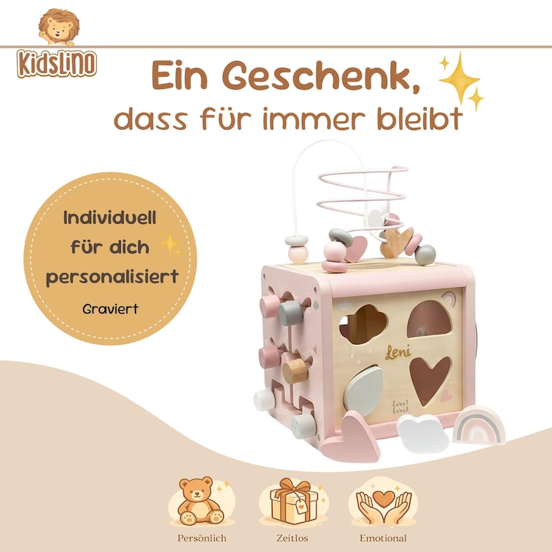 May include: A pink wooden activity cube with various shapes, colours, and interactive elements. The cube features a bead maze, shape sorters, and rotating blocks. Text on the cube reads "Leni". The image also includes the text "Ein Geschenk, dass f&uuml;r immer bleibt".