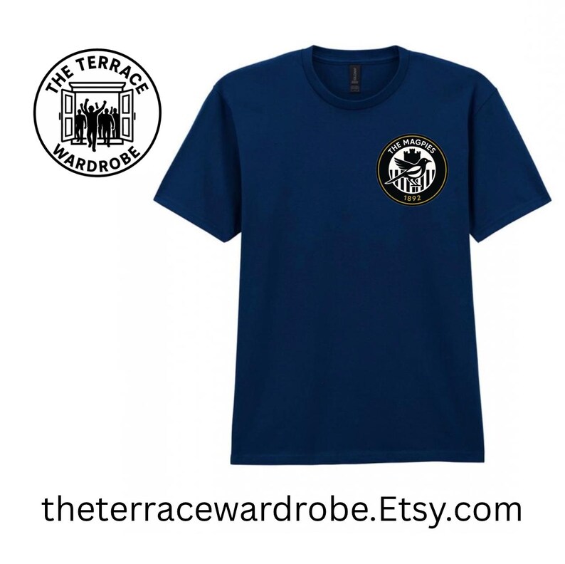 May include: Navy blue t-shirt with a circular logo on the chest that says "The Magpies 1872". A second logo on the upper left says "The Terrace Wardrobe". The website address is printed at the bottom.