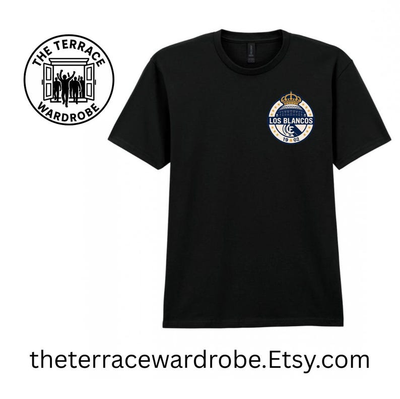 May include: Black t-shirt with a small, circular emblem featuring a crown, building, and text "LOS BLANCOS 19-02." The shirt also has a logo on the upper left with the text "THE TERRACE WARDROBE." The website address is theterracewardrobe.Etsy.com.