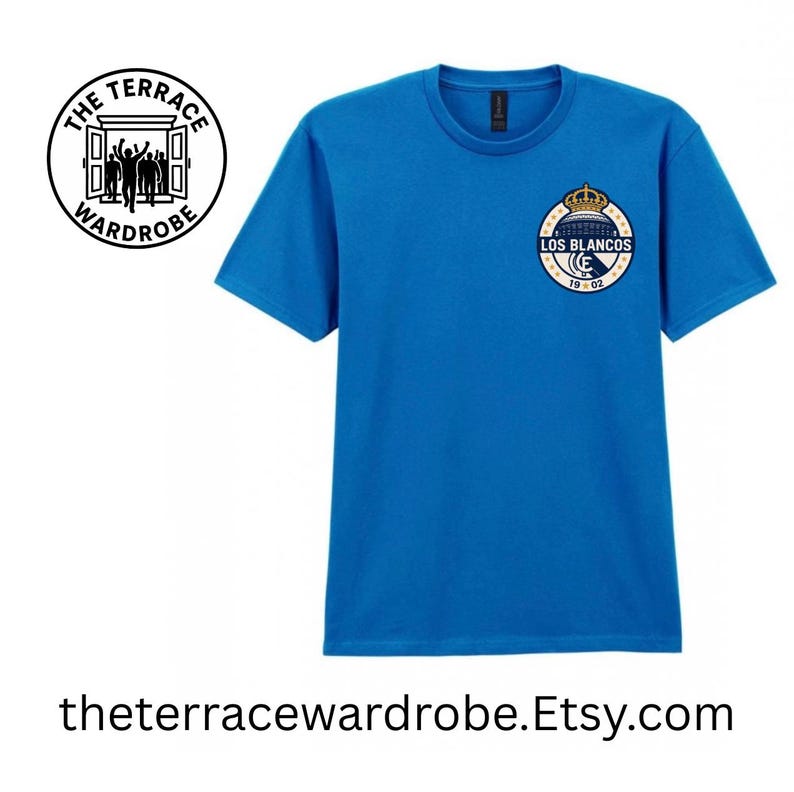 May include: A bright blue t-shirt with a crew neck and short sleeves. The shirt features a circular emblem with the text "LOS BLANCOS" and a crown design. The text "19-02" is also visible. The text "theterracewardrobe.Etsy.com" is at the bottom.