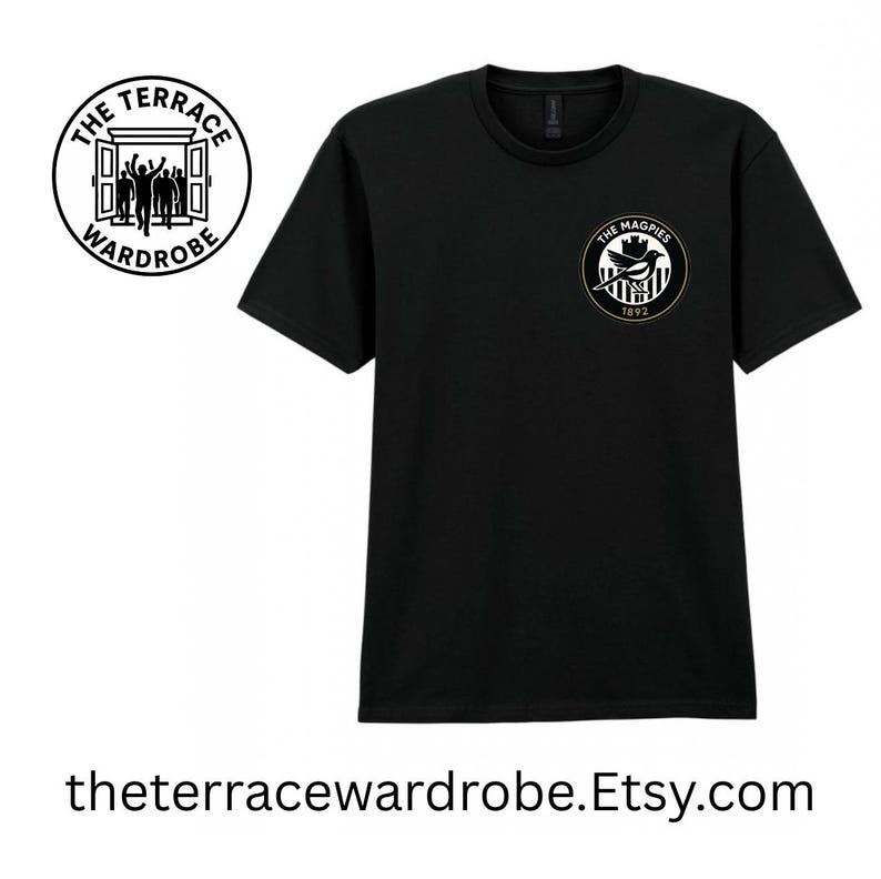 May include: Black t-shirt with two circular logos. One logo reads "The Terrace Wardrobe" and features a doorway with silhouettes. The other logo says "The Magpies 1892" with a bird and striped design. The website address is also visible.