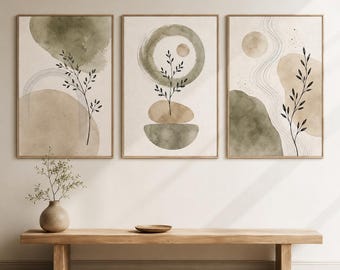 May include: A set of three framed wall art prints featuring abstract watercolor shapes in sage green and beige. Each print displays delicate black line drawings of botanical stems, curved lines, and circular forms on a neutral off-white background.