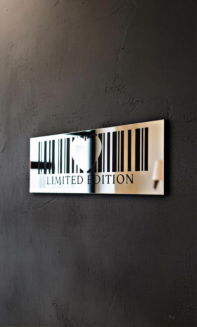 May include: A rectangular, mirrored wall art piece with a barcode design. A heart shape is cut out of the barcode, and the words "LIMITED EDITION" are printed below. The art is mounted on a dark gray textured wall.
