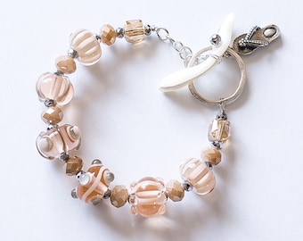 Bracelet - Handmade Lampwork Beads in Peach and Cream with Mother of Pearl (mop) clasp