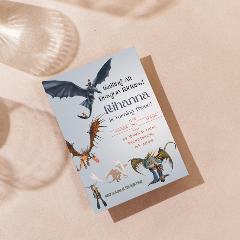 May include: A light blue invitation card featuring dragon illustrations and the text "Calling All Dragon Riders! Rihanna Is Turning Three!" The card includes event details and an RSVP contact.