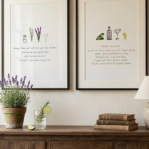 May include: Two framed wall art prints with black frames. The left print features illustrations of salt, rosemary, lavender, and a heart with text about love. The right print shows lime, a bottle, a glass, and text about a midnight margarita recipe.
