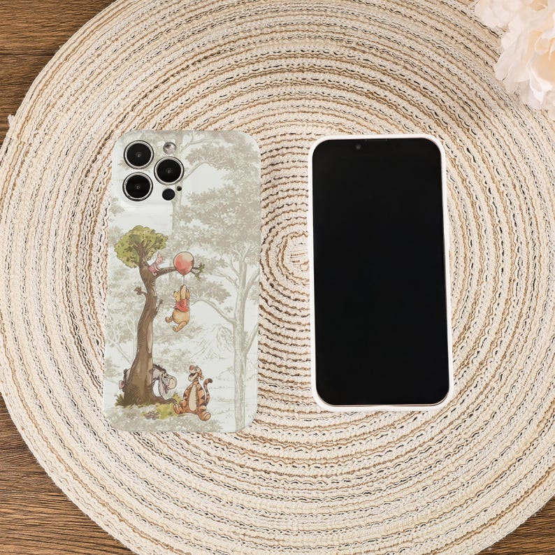May include: A white ceramic mug with a black handle and the text "But First, Coffee" in a bold, black font. The mug is set against a blurred background, suggesting a cozy setting. The mug appears to be approximately 4 inches tall.