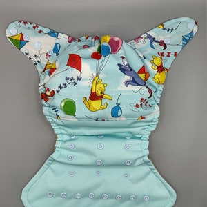 Cloth diaper SassyCloth one size pocket diaper with Winnie the Pooh cotton print. Made to order.