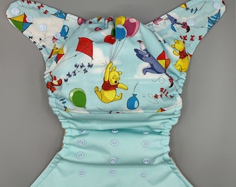 Cloth diaper SassyCloth one size pocket diaper with Winnie the Pooh cotton print. Made to order.