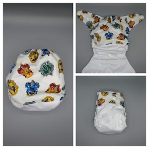 Cloth diaper SassyCloth one size pocket diaper with wizard school cotton print. Made to order.