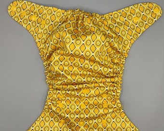 Cloth diaper SassyCloth one size pocket diaper with yellow diamonds geometrical PUL print. Made to order.