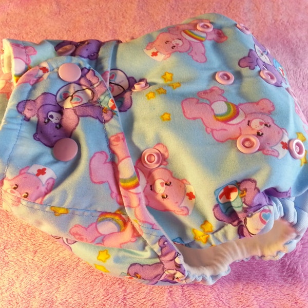 SassyCloth one size pocket diaper with care bears cotton print. Ready to ship.