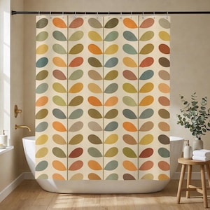May include: A shower curtain with a repeating pattern of colorful, leaf-shaped designs in shades of orange, yellow, green, and brown. The curtain hangs in front of a white bathtub, creating a decorative and functional bathroom element.