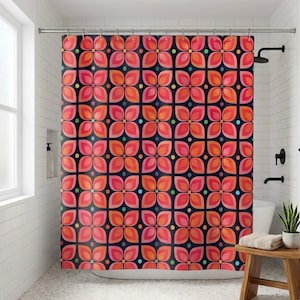 May include: A shower curtain with a repeating floral pattern in shades of pink, orange, and red on a dark navy blue background. The design includes small, colorful dots. The curtain is hanging in a white-tiled bathroom.