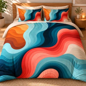 Peut inclure: Une parure de lit composée d'une housse de couette et de deux taies d'oreiller assorties, ornée d'un motif répétitif de lignes ondulées fluides dans des tons vifs d'orange, corail, bleu clair et bleu marine profond, disposées en dégradé.