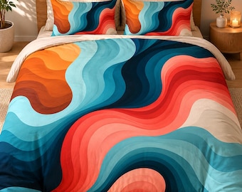 May include: A bedding set featuring a duvet cover and two matching pillowcases with a repeating pattern of fluid, wavy lines in vibrant shades of orange, coral, light blue, and deep navy blue, arranged in a smooth, flowing gradient across the fabric.