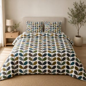 May include: A bedding set featuring a white duvet cover and two matching pillowcases with a repeating vertical pattern of stylised leaves in shades of olive green, dark blue, and brown. The leaves are arranged in symmetrical columns.