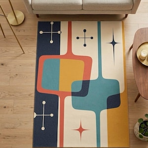 Könnte beinhalten: Ein rechteckiger Teppich im Mid-Century-Modern-Stil mit cremefarbenem Hintergrund und geometrischen Formen in Marineblau, Orange, Gelb und Türkis. Der Teppich hat Kreuz- und Sternmuster.