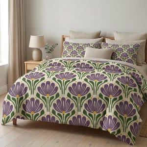 May include: A bed dressed with a duvet cover and pillowcases featuring a repeating floral pattern. The design showcases large purple flowers with green stems and yellow centers against a cream backdrop. The bed is made up with several pillows and a wooden bed frame.