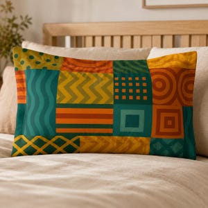 May include: A rectangular pillowcase featuring a patchwork design of various geometric patterns including stripes, waves, circles, squares, and zigzags in a vibrant color palette of mustard yellow, burnt orange, teal, and dark forest green.
