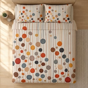 May include: A cream-colored bedding set with a pattern of vertical lines and colorful circles in shades of orange, brown, gray, and blue. The set includes a duvet cover and two pillowcases, creating a cohesive and stylish bedroom aesthetic.