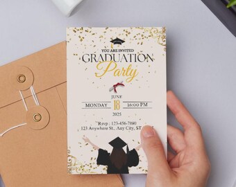 May include: A graduation party invitation with gold accents and the text "Graduation Party". The invitation is held in front of a brown envelope. A white pen and a small plant are also visible.
