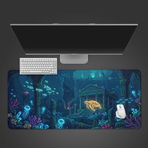 May include: A rectangular desk mat featuring a detailed underwater scene with glowing blue jellyfish, coral reefs, stone ruins, and a bright yellow sea turtle swimming near a temple structure, all set against a dark blue ocean background.