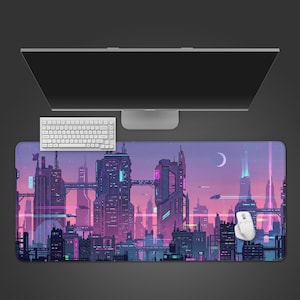May include: A large rectangular mouse pad featuring a futuristic cityscape design in shades of purple, pink, and blue. The pad has a computer keyboard, a white mouse, and a computer monitor on top. The design includes buildings, flying vehicles, and a crescent moon.