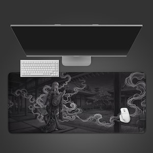 May include: A monochrome desk mat with a Japanese-inspired design of a woman playing a lute. A white keyboard, mouse, and computer monitor are also present in the image.