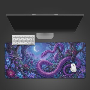 May include: A rectangular desk mat featuring a vibrant illustration of a large purple snake coiled around trees in a forest at night. The scene includes glowing mushrooms, colourful flowers, and a crescent moon in a starry sky, with a white mouse on top.