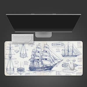 May include: A large rectangular mouse pad featuring a detailed blue and white nautical blueprint design of a tall ship. The design includes various ship views and the word "APPROVED". A white keyboard and mouse are also present.