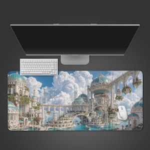 May include: A large rectangular desk mat featuring a fantasy city scene with turquoise domes, white buildings, and a blue sky with fluffy clouds. A white keyboard and mouse are visible, along with a computer monitor.