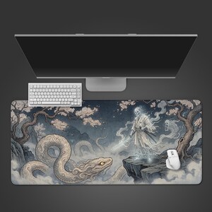 May include: A rectangular desk mat featuring a detailed illustration of a spectral samurai figure with a skull face holding a glowing sword, standing on a cliff edge near a large, coiled serpent amidst misty trees with pale pink blossoms.