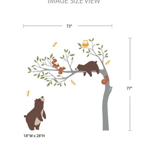 May include: A wall decal featuring a large tree with brown bears, squirrels, and an owl. The tree is 73 inches wide and 77 inches tall. The decal also includes a smaller bear that is 18 inches wide and 28 inches tall.