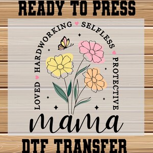 May include: A DTF transfer featuring a floral design with the word "mama" in a script font. The design includes yellow, pink, and peach flowers, a butterfly, and the words "loved, hardworking, selfless, protective". The text "READY TO PRESS" is at the top.