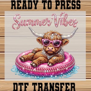 May include: A DTF transfer featuring a cartoon Highland cow wearing pink sunglasses and a necklace, lounging in a pink inflatable ring. The text "Summer Vibes" is above the cow, and "READY TO PRESS" and "DTF TRANSFER" are at the top and bottom.