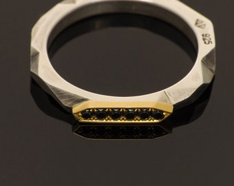 Geometric faceted silver ring, with 18ct yellow gold top and black diamonds